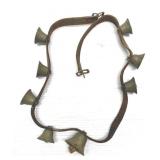 Antique brass bells on leather strap