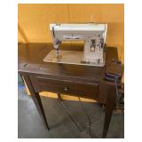 Vintage Singer Sewing Machine in cabinet