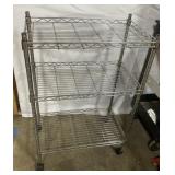 Rolling metal shelf approx 3 foot tall Rolling metal shelf approx 3 foot tall