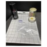 Axe body spray, laminating sheets, and a candle