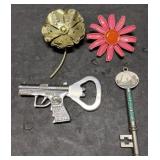 Brooches, bottle opener & Arch key