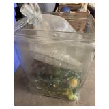 Large glass water jug with plastic fruit, lights,