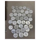 Plastic coins in Tin container