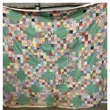 85 x 72 handpiece quilt. The top has been pinned