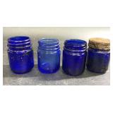 4 cobalt blue antique jars-each is 2 1/2"-1 has