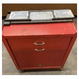 Stack on metal tool box with wheels and contents.