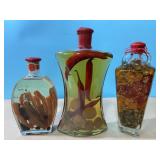 Trio of gourmet oils. 1 infused with mango and