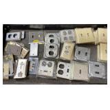 Plastic and metal outlet covers, different sizes