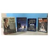 4 hardback books with covers