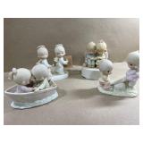 4 precious moments figurines, 1 plays music