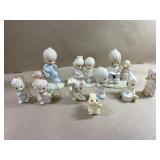 9 Precious Moments figurines and a bunny happy