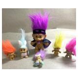 6 troll figurines, 3 are pins
