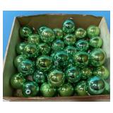 Box of green vintage Christmas ball ornaments