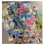 Snaps, buttons, hook and eyes, knitting needles,