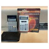 3 electronic items, 2 calculators and a Rolodex