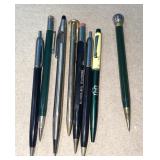 Assortment of older pens and mechanical pencils.