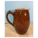 Vintage stoneware pitcher with a couple cracks Vintage stoneware pitcher with a couple cracks