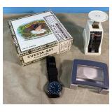 Watch with cloth band, scale, magnifier and cigar Watch with cloth band, scale, magnifier and cigar