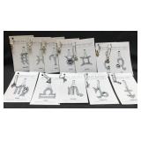 NICE lot of zodiac charms on cards! NICE lot of zodiac charms on cards!