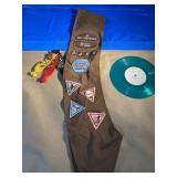 Girl Scout badge and pins, accompanied by Green