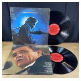 Two vintage Johnny Cash vinyl records. At San