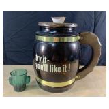 10" tall glass mug jar with wood lid. And you get