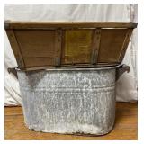 Metal bin with a couple holes 21 X 12 
  and a