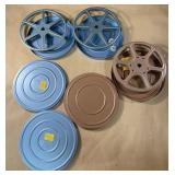 3 film reels and canisters