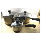 Vintage Revereware copper bottom pots with lids