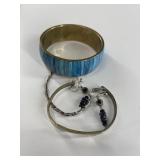 Assorted jewelry with an old twisted silver bracel