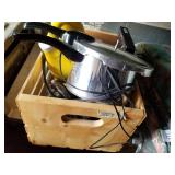 Wooden crate with a pressure cooker, headphones, d