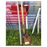 Lot with garden tools including shovels and dirt c