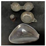A wine tasting cup, lead candy mold, etc