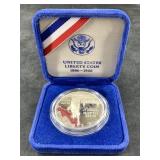 1986 S Ellis Island silver dollar in mint case
