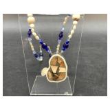 Crystal, pearl and fossil walrus and mammoth ivory
