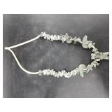 Stone statement necklace with dozens of carved ani