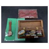 Lot with a wrist watch, self inking stamp pad, a b