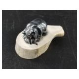 Hemetite bear statueteon an antler base, a little
