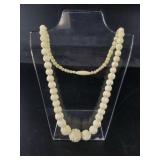 Small tapered ivory beaded necklace with threaded