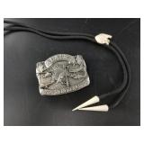 Ivory bolo tie, and an Alaska national Guard belt