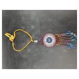 Hand beaded necklace pendant with leather cord