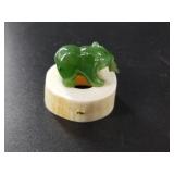 Alaskan Kobuk jade bear statuette on an ivory base