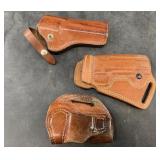3 Assorted leather hand gun holsters