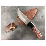 Damascus bladed knife with wood scales and leather