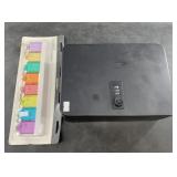 Lot with a small combo safe  and key tags