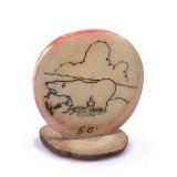 Scrimmed ivory platchet on fossilized ivory base,