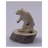 Very detailed carving of an upright polar bear on