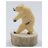 Very detailed carving of an upright polar bear on