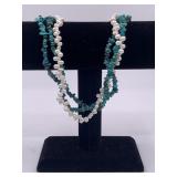 Multi-tiered necklace made with ringed pearls and