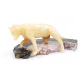 Fossilized ivory fox, on small geode piece about 2